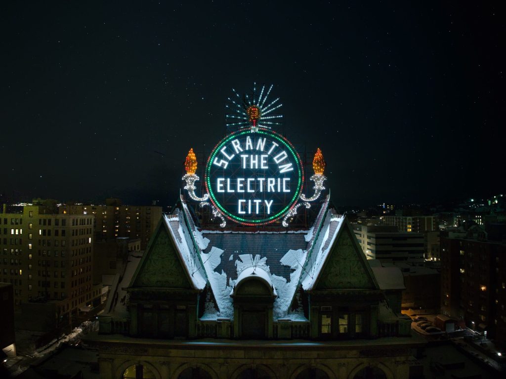 The Electric City sign, lit at night, January 2024