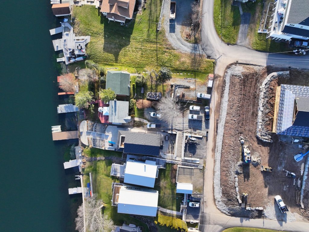 Overhead drone photo of a lakefront property and docks on Lake Winola, PA