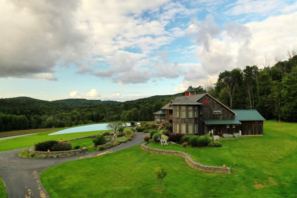 Drone photo of a country estate with a pond and mountain views, Northeastern Pennsylvania