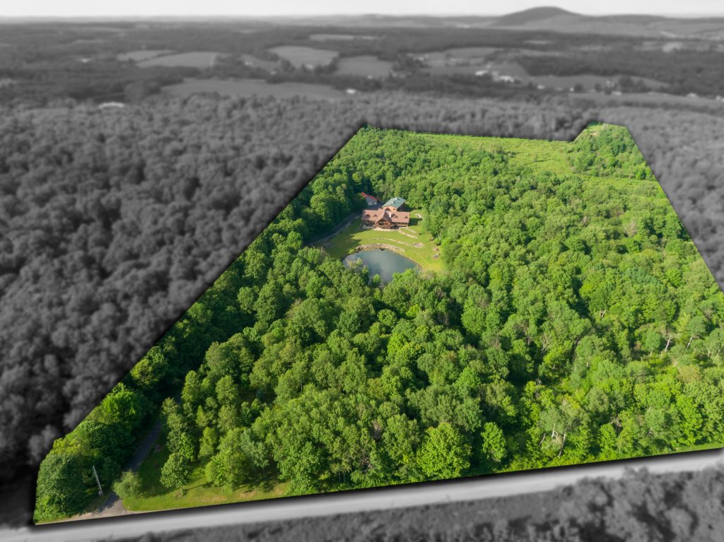 Aerial photo of wooded acreage near Thompson, PA with the property boundary highlighted