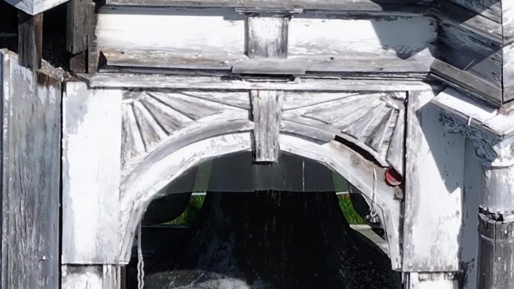 Close-up drone inspection photo of church steeple detail